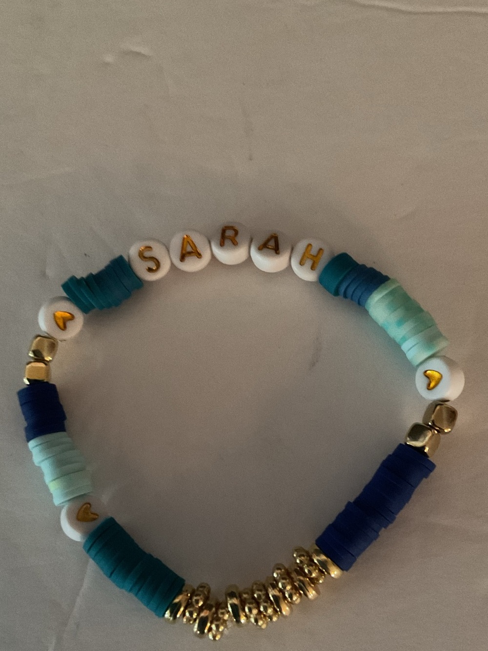 Slip on Personalized Sarah Beaded Bracelet in Teal & Blue with Gold Accents.
